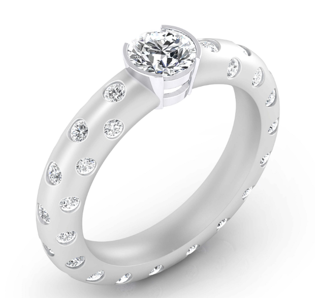 Detalle de anillo de autor con engaste artesanal y proporciones de diseño en oro blanco de 18k