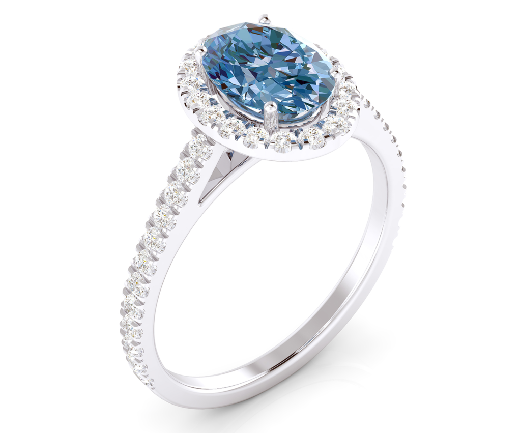 anillo de alta joyería con topacio talla oval y diamantes en el brazo y alrededor de la piedra